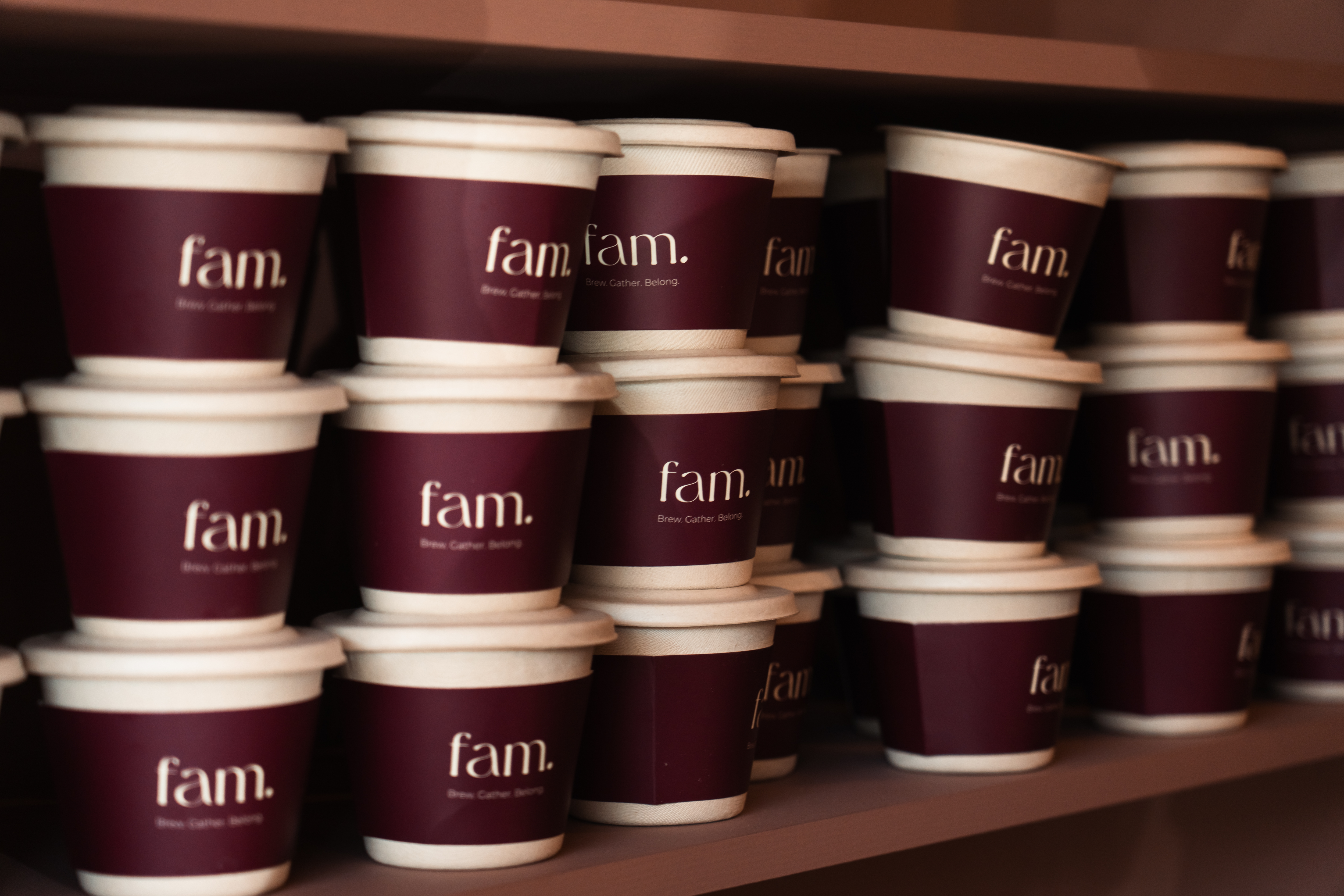fam. branded cups stacked on a shelf